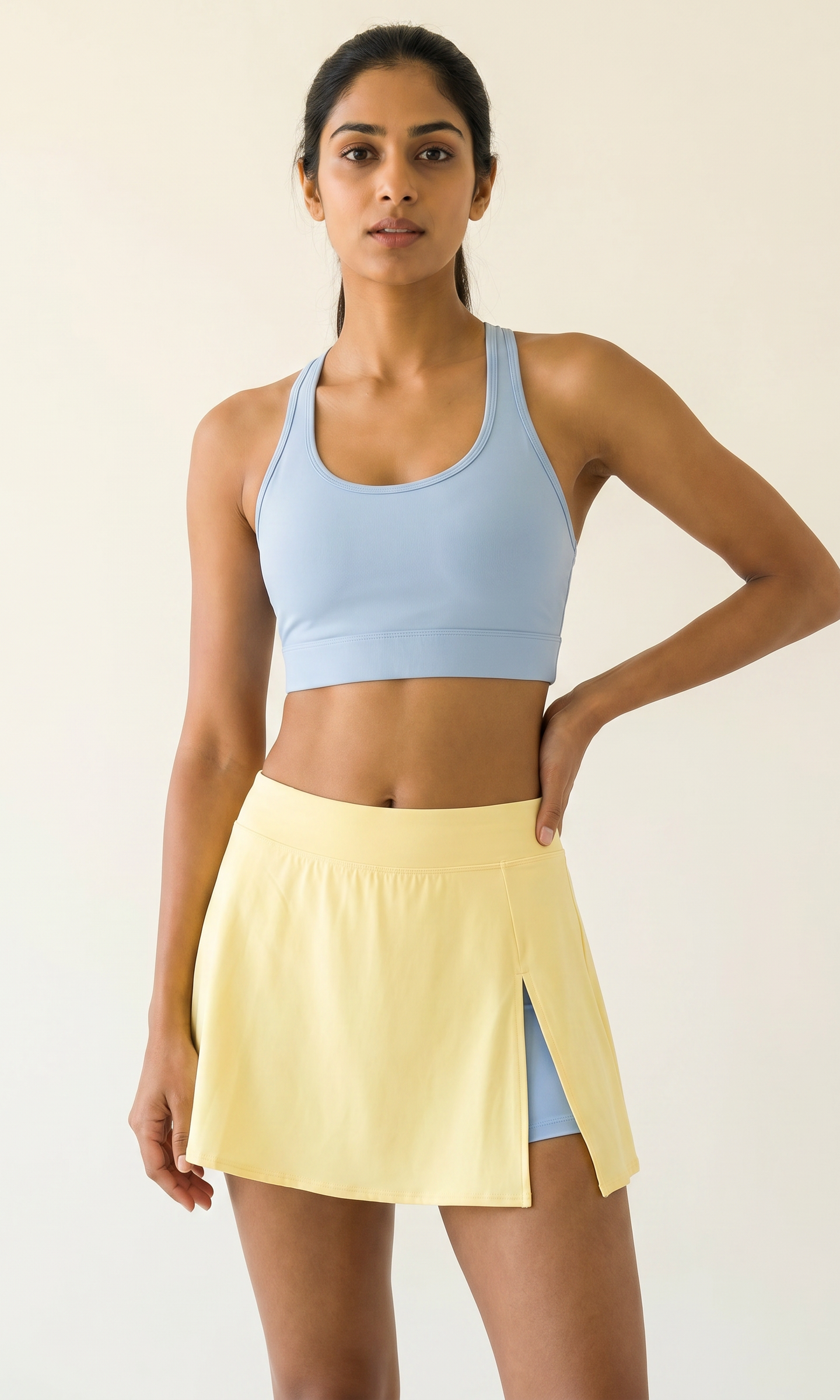 Aurora Sunray Skort Set β Horizon Blue racerback bra with butter yellow side-slit skort on Indian model