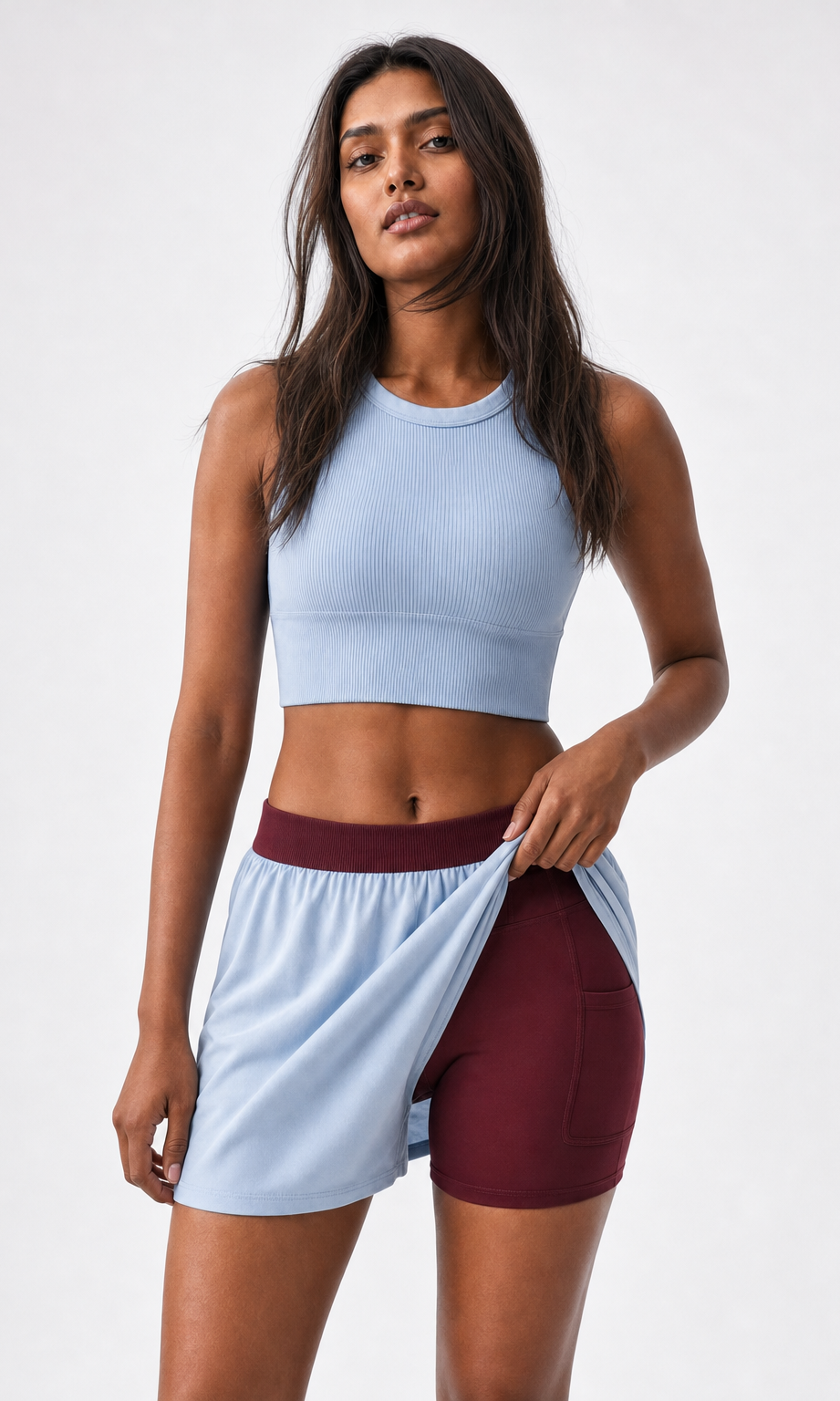 DuoEase Shorts - lifting outer layer to show burgundy inner liner with pocket