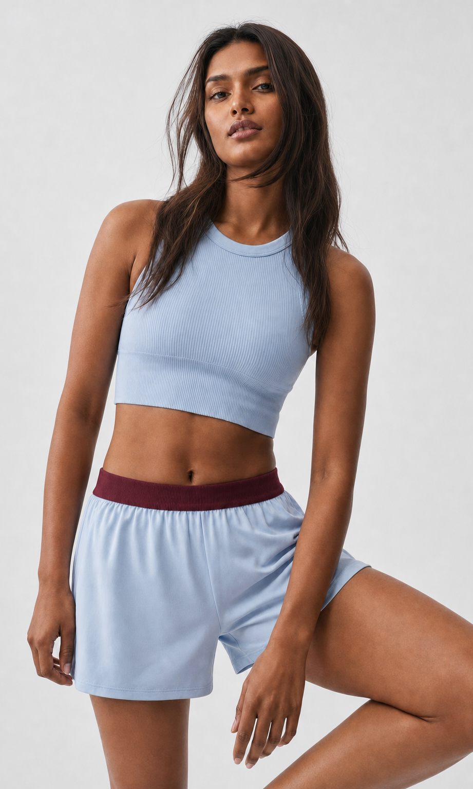 Ice Blue shorts with burgundy waistband - front view on model