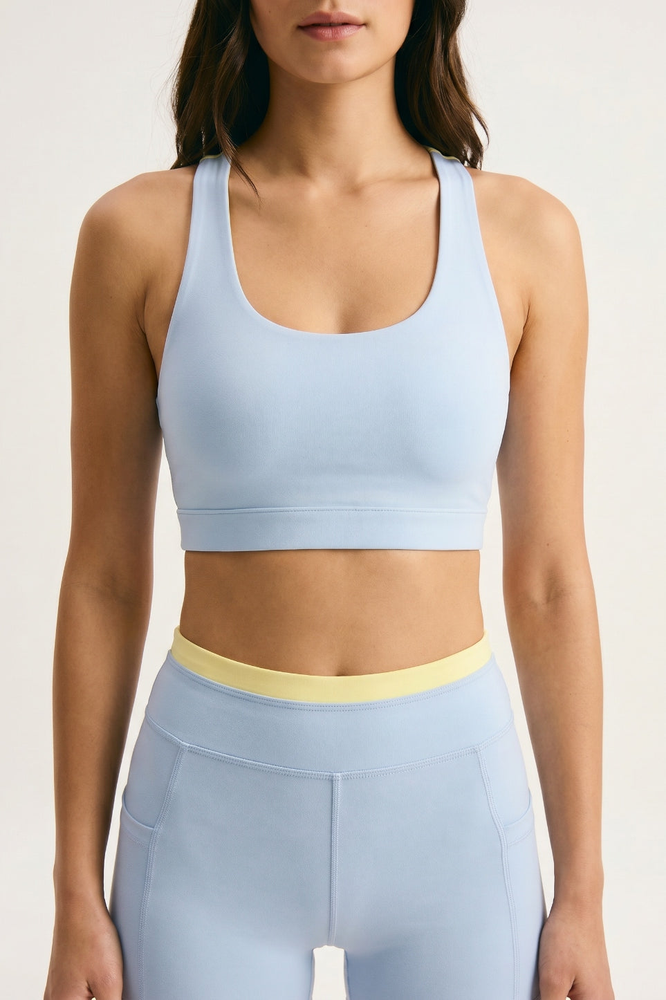 Skyline Reversible Sports Bra closeup — Horizon Blue scoop neck racerback with butter yellow reversible back