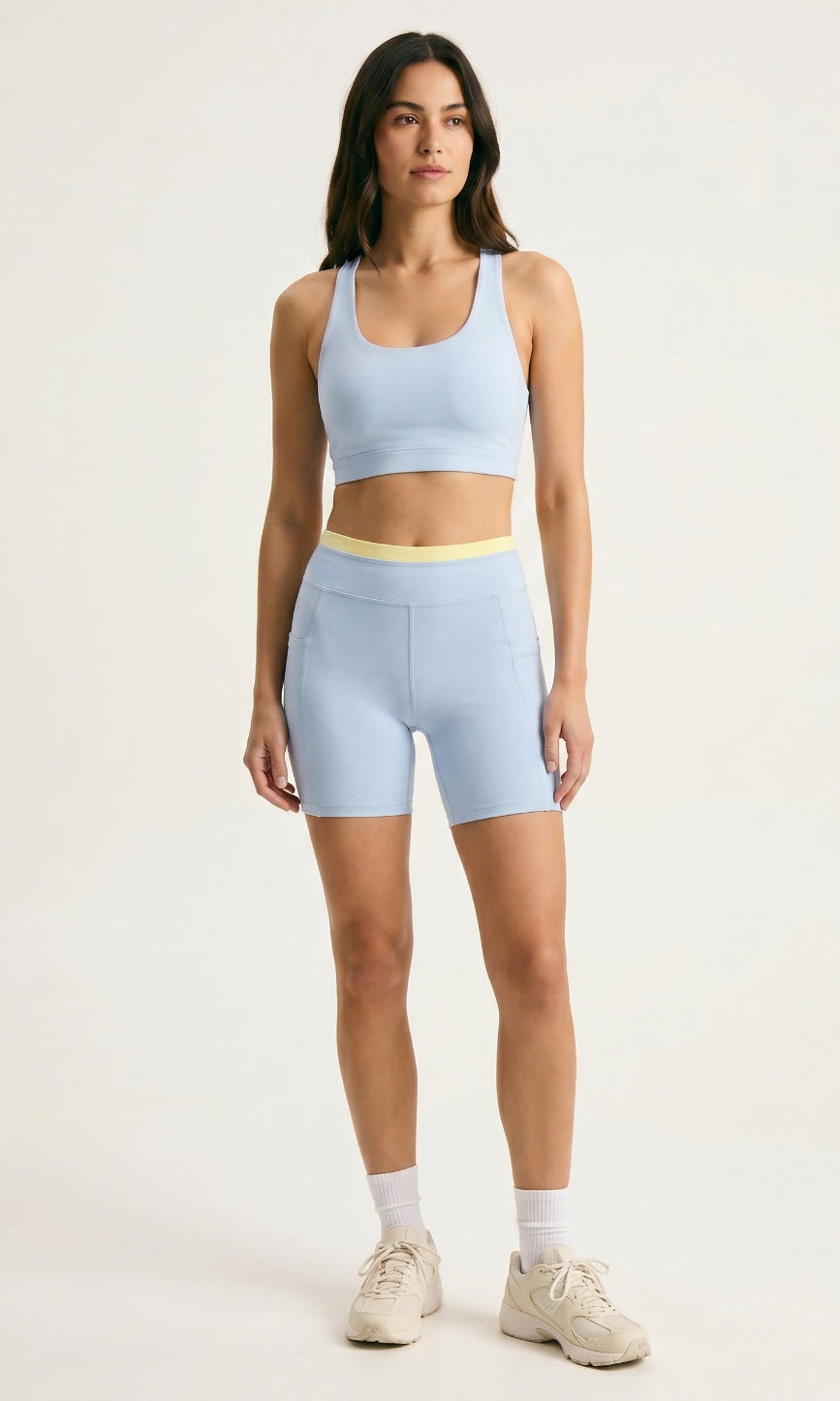 Skyline Reversible Set β Horizon Blue racerback bra and matching biker shorts with butter yellow waistband, front view