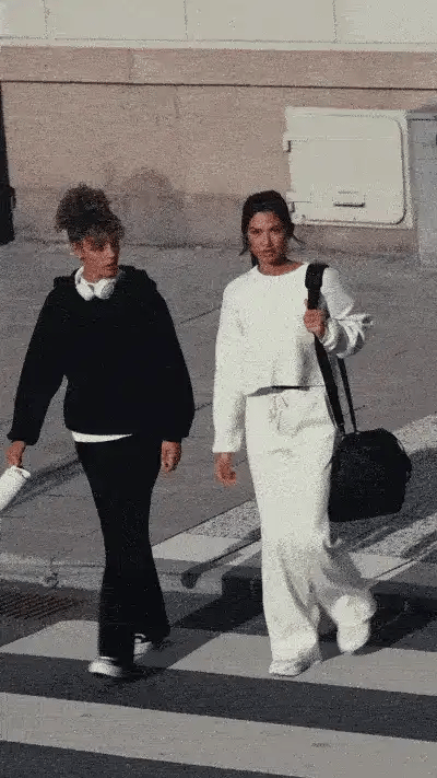 2 women walking in the road