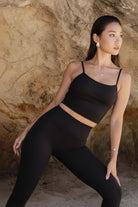 A Women wearing Flexorm Leggings which is made from recycled fabric a sustainable activewear by Terraloop
