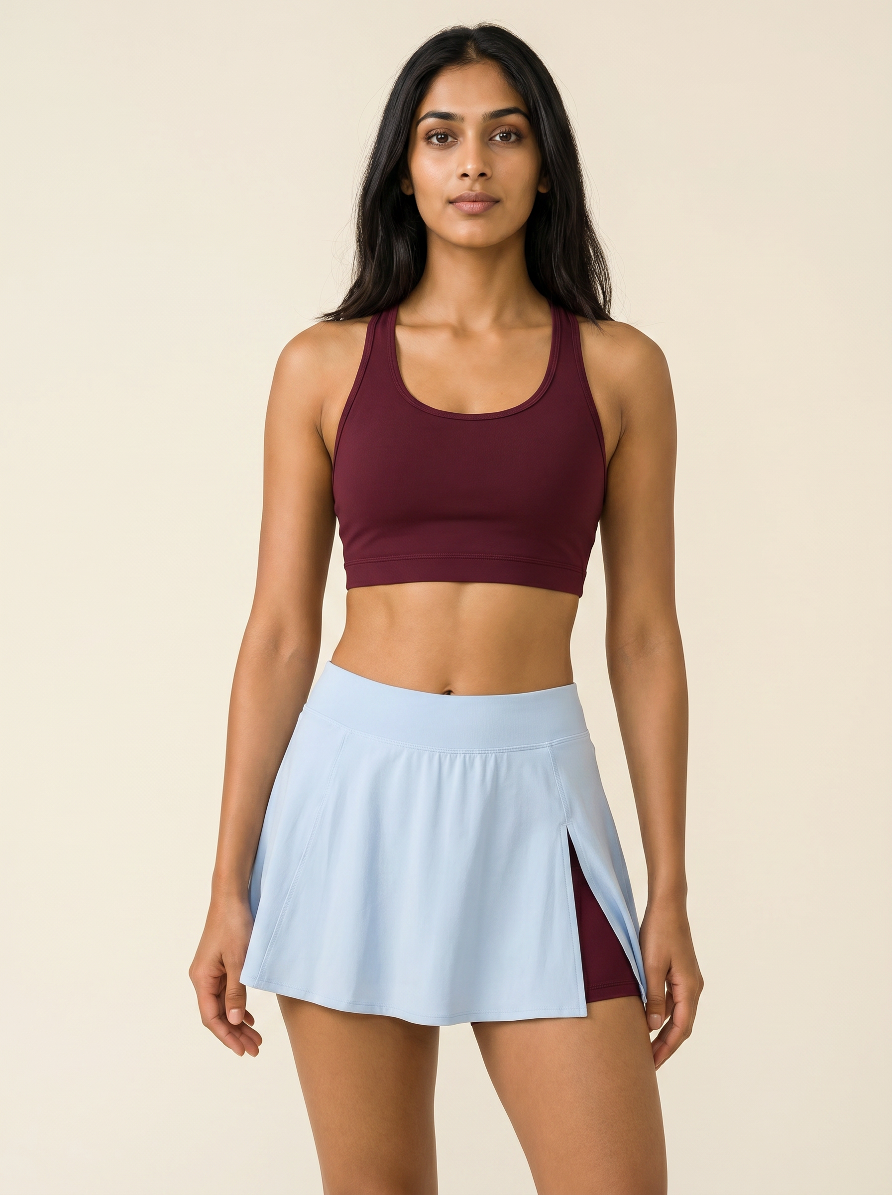 Aurora Ember Skort Set — Earth Red burgundy racerback bra with Horizon Blue side-slit skort on Indian model