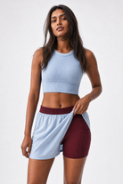 DuoEase Shorts - lifting outer layer to show burgundy inner liner with pocket