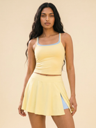 FlexTank Sunray Skort Set — Butter yellow square neck tank with butter yellow side-slit skort on Indian model