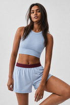 Ice Blue shorts with burgundy waistband - front view on model