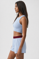 Ice Blue shorts with burgundy waistband - side view on model