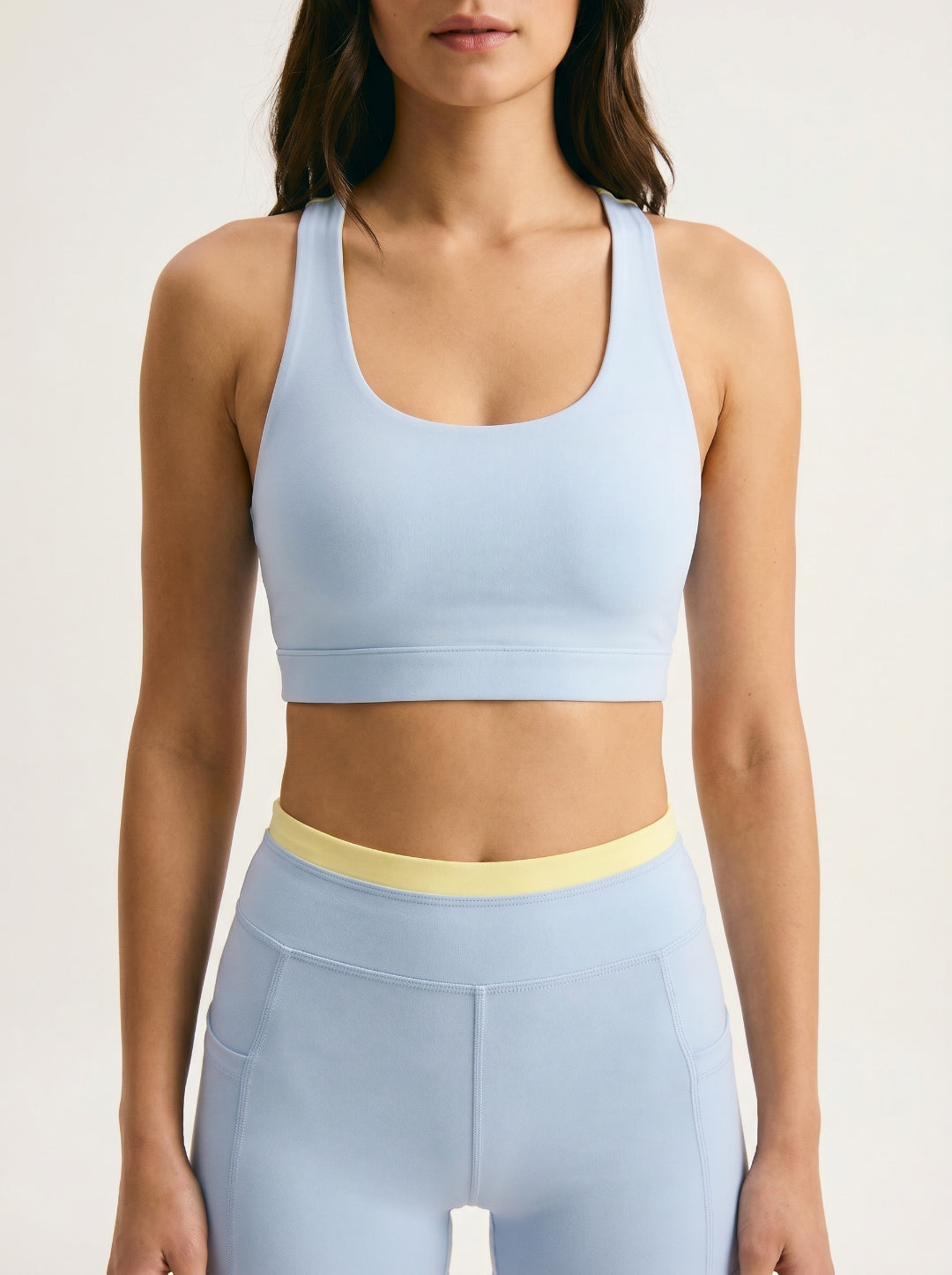 Skyline Reversible Sports Bra closeup — Horizon Blue scoop neck racerback with butter yellow reversible back