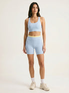 Skyline Reversible Set — Horizon Blue racerback bra and matching biker shorts with butter yellow waistband, front view