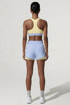 Terraloop DualWave Shorts - Back view showing yellow colorblock panels