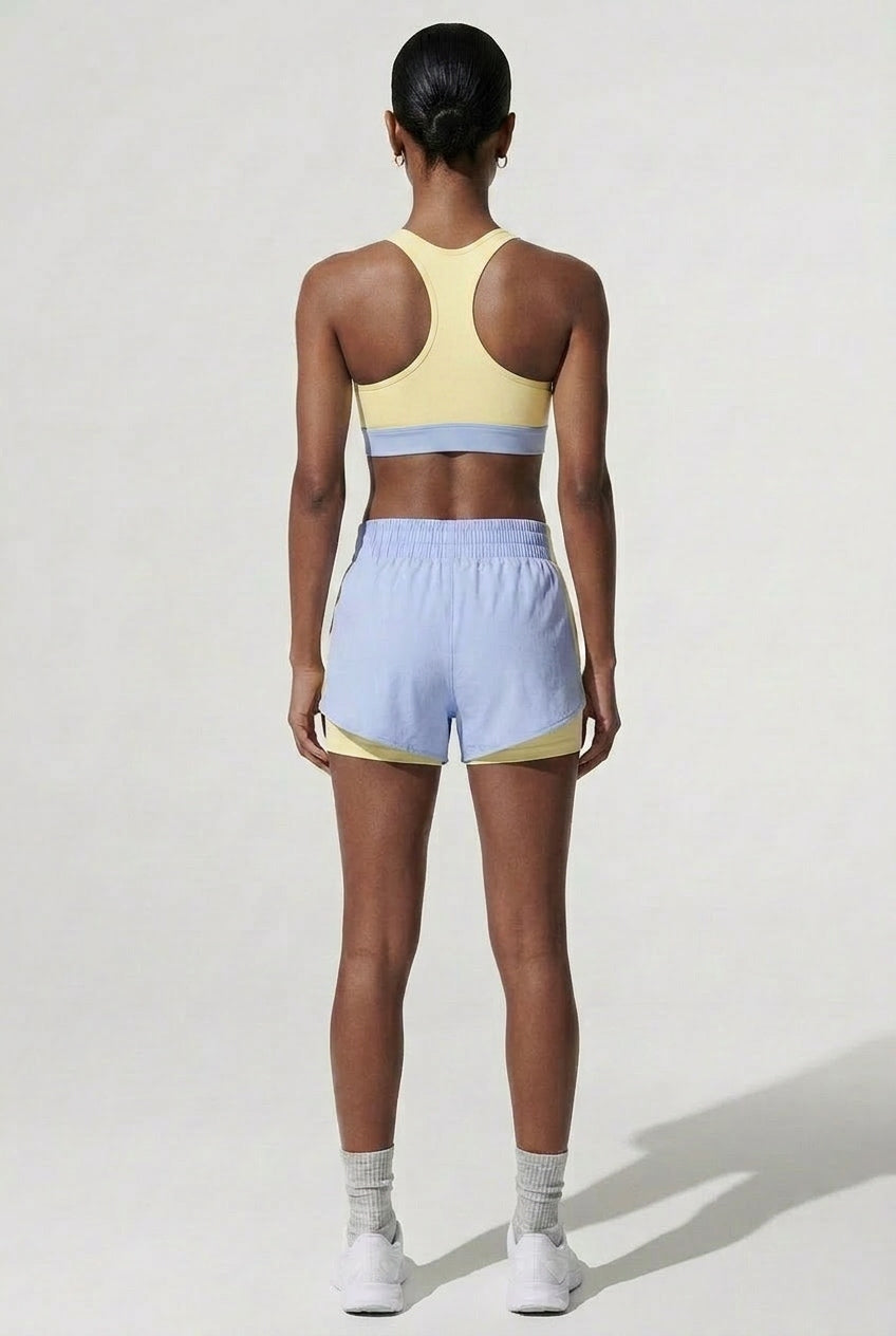 Terraloop DualWave Shorts - Back view showing yellow colorblock panels